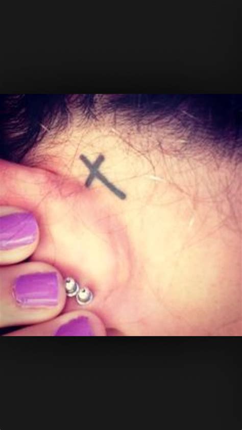 Small cross behind ear tattoo Small cross