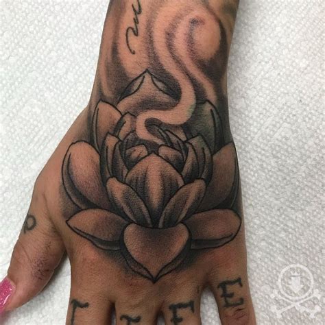 This one is not only on the chest, but this is a rather small lotus flower tattoo. Awesome lotus flower hand tattoo by David Carreras at our ...