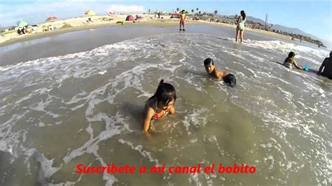 The policeman is seen accepting a. Niños jugando en la playa de Ensenada Baja California CAM ...