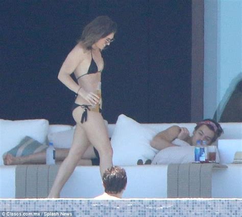 Check spelling or type a new query. Harry Styles lounges poolside in Mexico with mystery woman ...