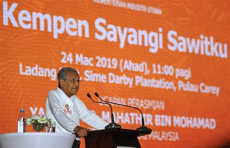 A worker loads oil palm fresh fruit bunch into a lorry at a local oil palm plantation in shah alam outside kuala lumpur. The Launch of Love My Palm Oil Campaign