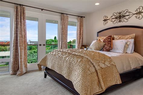 Refreshed french residence, master bedroom with vaulted ceiling by allison seidler interiors. Master bedroom with french doors leading to a nice little ...