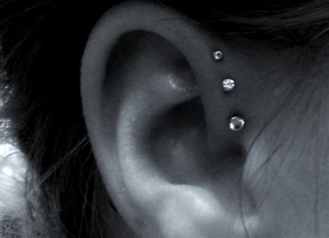 Helix piercings are presented in different variations, and it's common to have more than one. In My Own Skin: Triple Forward Helix Piercing