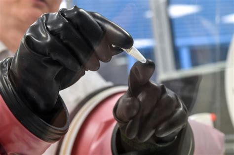 A nurse prepares to administer a dose of the pfizer vaccine. Tuberculosis vaccine eyed in fight against coronavirus