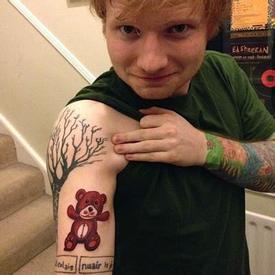 In this ed sheeran tattoo, each puzzle piece is for a friend, or mate, who has a corresponding piece tattooed on them. family tree tattoo - Celebrities Tattooed