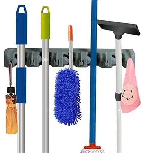 A wall mounted storage rack for your mops and brooms. RockBirds Wall Mounted Mop And Broom Holder, Storage ...