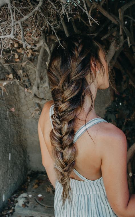 A voluminous messy braid is a perfect location for a flower crown, leaving locks flowing down the spine. braid bohemian hairstyle for long hair messy and easy ...