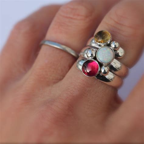 The delicate style of this slender band and its sparkling birthstones, makes a perfect gift to celebrate mom and all that. Birthstone Ring. Fairy Tale Ring. Three stone. Sterling ...