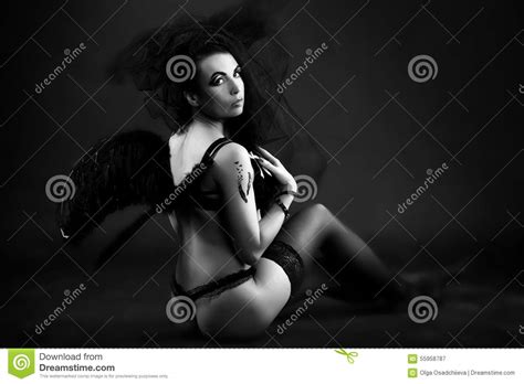 You can find more videos like angel dark striptease below in the related videos section. Woman Black Angel Stock Photo - Image: 55958787