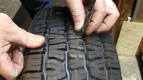 Hold the gauge in place and read the results. How To Use a Tire Tread Depth Gauge - YouTube