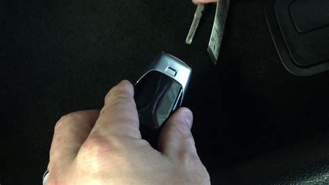 At the end of the key holder, pull the latch and stick your key into the open slot. Mercedes key fob battery replace - YouTube