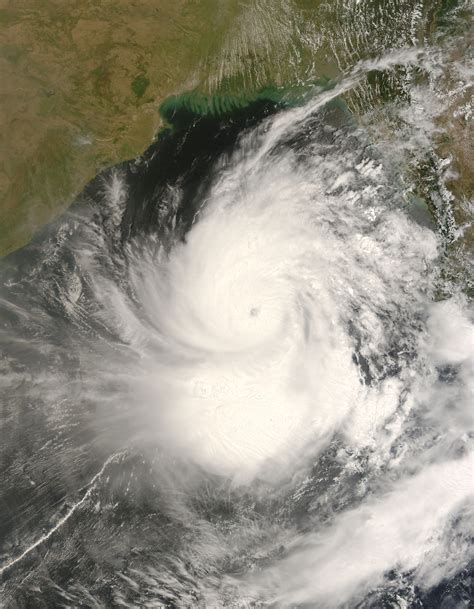 In meteorology, a cyclone (/ˈsaɪ.kloʊn/) is a large scale air mass that rotates around a strong center of low atmospheric pressure, counterclockwise in the northern hemisphere and clockwise in the southern hemisphere as viewed from above (opposite to an anticyclone). Ciclón Nargis