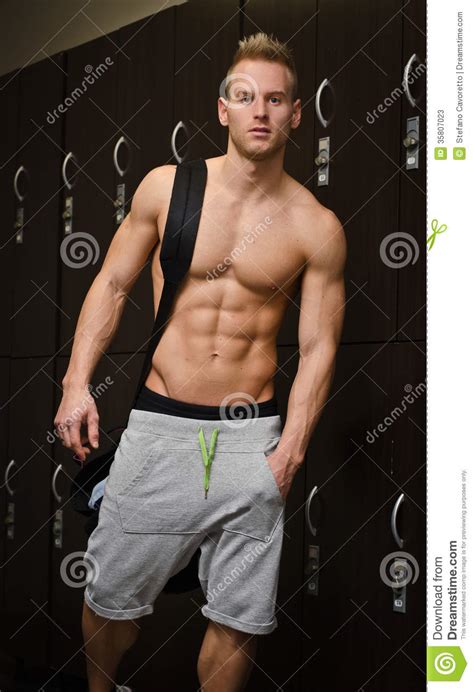Got a raw muscle guy you fantasize about? Shirtless Muscular Young Male Athlete In Gym Dressing Room ...