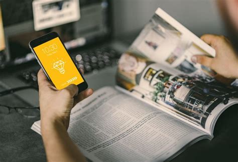 Simple, personalized mockups with our customizable templates. Man holding iPhone With magazine Mockup PSD | Download Mockup