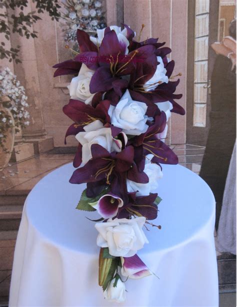 .flowers, artificial lily fake lily artificial flower wedding party decor bouquet home hotel office a bouquet of lilies has a total length of about 31.5 inch, 7 leaves, an expanded diameter of the usage of artificial lily silk flowers as charming decorations and making bouquets with artificial. Fabulous Fakes: Sangria, Purple, Plum