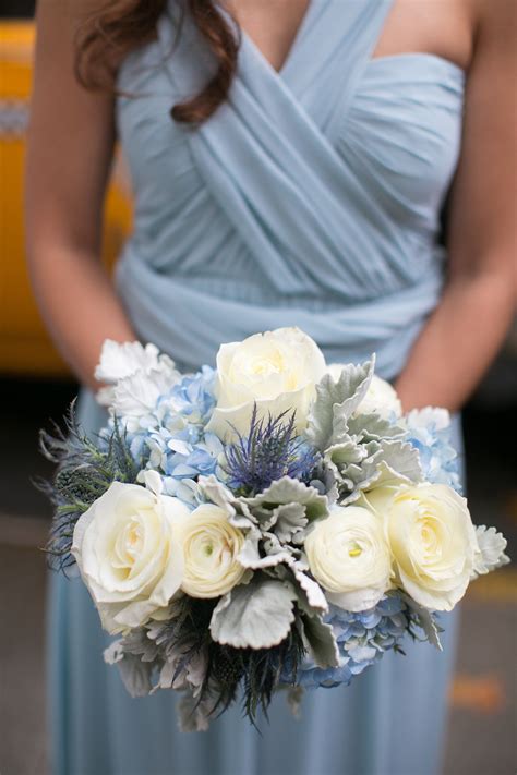 White, cream, silver, and green combine well with both purple and blue, while yellow is a lovely accent color. Blue and White Bridesmaid Bouquet | Blue wedding flowers