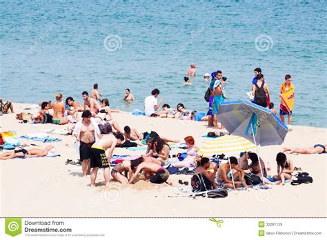 Find the perfect barcelona beach woman stock photo. People Sunbathing At Bogatell Beach In Barcelona Editorial ...