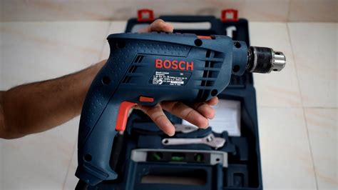 It features a powerful motor;a compact design and is light in weight. BOSCH Tool Kit GSB 500W 10 RE Professional Unboxing and ...