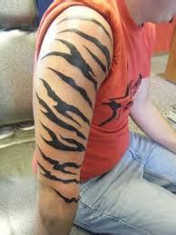 Colorful tiger tattoo for men on guy with tiger tattoo on full sleeve. Tiger stripes | Stripe tattoo, Tiger stripe tattoo, Tiger ...