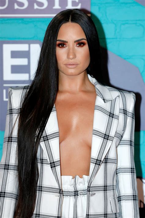 It was originally a nickname of demetria, the feminine form of the masculine name demetrius, which is itself the latin and english spelling of the greek name demetrios. Demi Lovato Sports Some Serious Cleavage in Sexy MTV EMAs ...