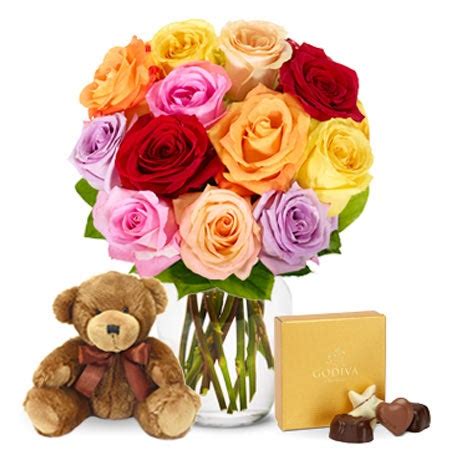 We deliver on all occasions. One Dozen Rainbow Roses with Chocolates and Teddy Bear at ...