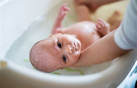 Place the baby bath in a clean sink, bathtub, or on the floor, depending on the manufacturer's instructions. How to safely bathe your newborn: Simple steps for baby's ...