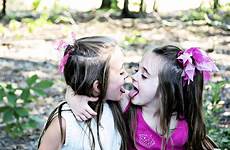 tongues sisters playfully tong