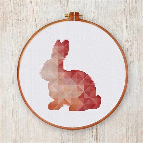 You need to grab my free 70 christmas cross stitch patterns to print! Geometric Bunny cross stitch pattern| Cute coral nursery ...