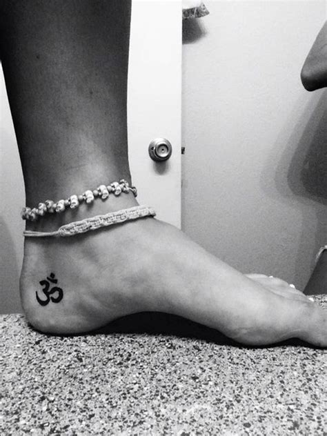 Om is a spiritual sound and a sanctified icon in the hindu religion. om tattoo on foot | Foot tattoos, Funky tattoos, Ohm tattoo