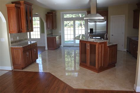 Choosing and buying kitchen floor tile is challenging. Should your Flooring Match Your Kitchen Cabinets or ...