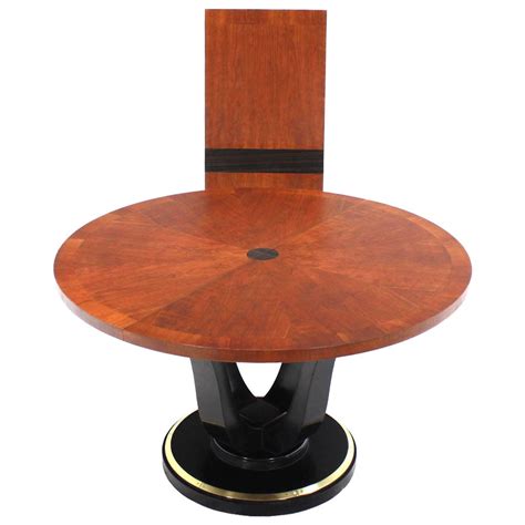 Click the images to view more information and options. Henredon Single-Pedestal Round Dining Table at 1stdibs