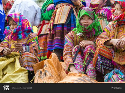 Bac Ha, Vietnam - April 6, 2014: Flower Hmong tribes people sitting at Sunday market, Bac Ha ...
