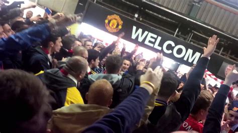 Tottenham fans show their support as they social distance in the stand photograph: Arsenal fans going nuts pre-match at Old Trafford ...