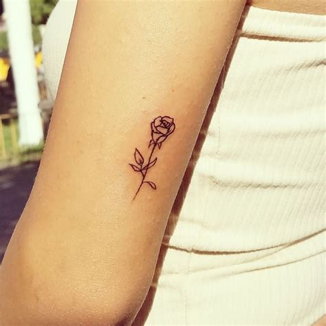A great example of how you can have roses incorporated into a larger design. Tiny rose tattoo | Tiny rose tattoos, Tattoos, Rose tattoo
