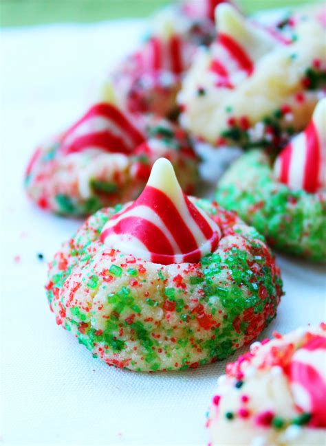 This recipe is so simple and so easy to change up!! Hershey Candy Cane Kiss Cookies - roseandlea.com | Christmas cooking, Christmas food, Kiss cookies