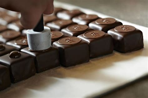 Prior to conching, chocolate had an uneven and gritty texture. Max Chocolatier | Swiss chocolate brands, Chocolatier ...