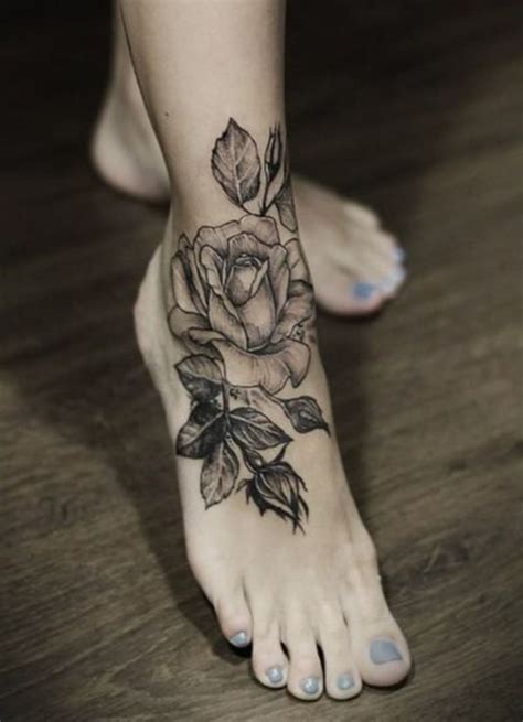 Black and gray tattoo with anchor and lifebuoy on foot. 20 Superb Flower Tattoo Designs for Women - SheIdeas