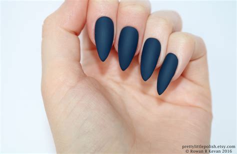 You can either leave it as is, or add a clear top coat to. Matte dark blue stiletto nails, Fake nail, Stiletto nail ...