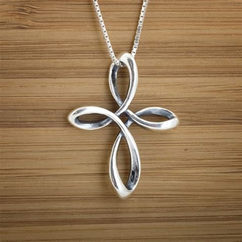 The tattoo is stunning, and one can easily sport it on their feet as well. Sterling Silver Celtic Infinity Cross Double Sided | Etsy ...