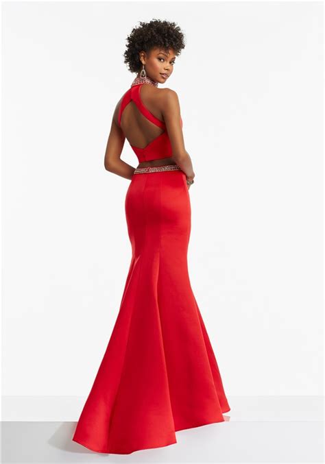 If you have a halter top in your closet, then you've got an idea of what this style looks like. Trumpet Halter Open Back Two Piece Red Satin Beaded Prom Dress