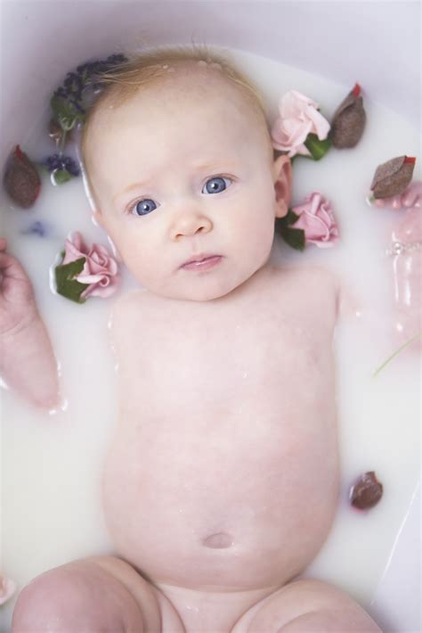 Roll baby's hands in her shirt to keep baby's hands clean. Rosie's Baby Milk Bath