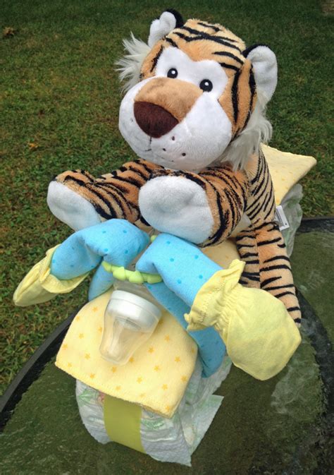 Over the last year i have had a few occasions where i have been asked to make a motorcycle diaper cake for a baby shower gift. How to Make a Motorcycle Diaper Cake - Mommy's Fabulous Finds