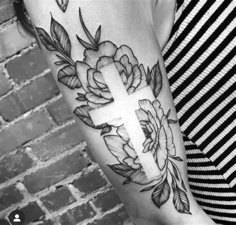Negative space, in art, is the space around and between the subject(s) of an image. Negative Space Cross and Floral Tattoo in 2020 | Tattoos ...