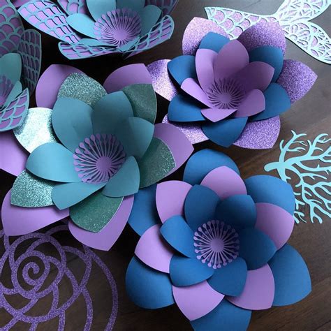 If you're looking to add some extra dimensions to your décor at a reasonable price, consider our hanging paper lanterns.hang these from trees, branches, arches, or ceilings, and you'll transform your ordinary party scape into a surrealistic paradise of asian culture. Mermaid Theme Paper Wall Flowers Extra Large Nursery & image 1 | Paper flowers diy easy, Paper ...