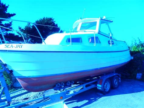 One tan and the other is green. Cabin Cruiser Boat & Braked Trailer Inboard Diesel Engine ...