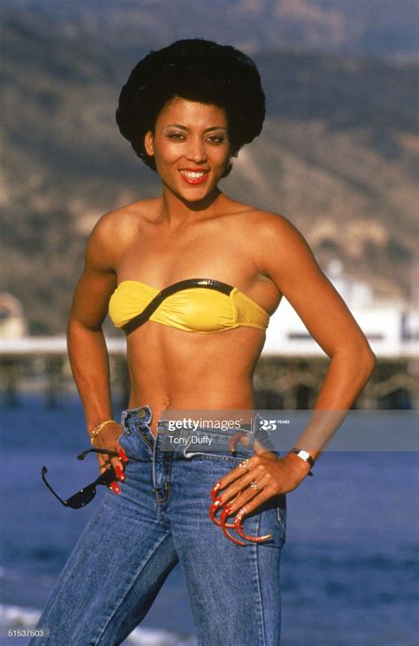 Won 3 gold medals at '88 olympics (100m, 200m, 4x100m relay); Florence Griffith Joyner poses for a portrait in 1988 ...