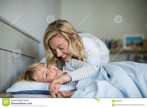 A mother and daughter spend a night together after the daughter reveals that she will kill herself by the end of it. Mother And Son Having Fun Together In The Bedroom Stock ...