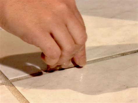 Learn how to clean grout (the easy way) today and get it sparkling white again. How to Clean Kitchen Floor Grout | how-tos | DIY