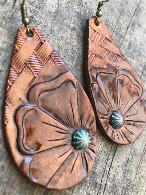 Check spelling or type a new query. Western floral tooled earrings | Leather earrings, Diy ...