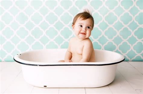 Help your cute child take a bubble bath and get dressed! 7 Baby Bath Time Safety Hacks | Vitacost Blog